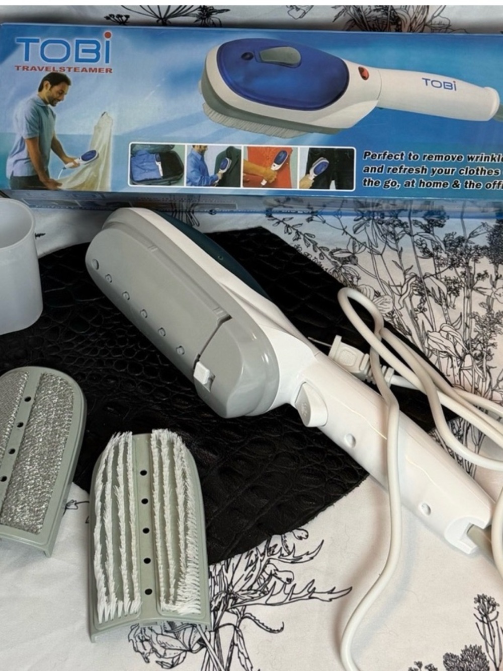 Tobi Handheld Garment Steamer - White and Blue. Great for a fast touch-up.